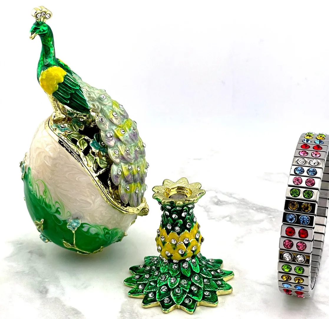 PEACOCK  Designr Green Faberge Easter Eggs in the Russian Faberge style, featuring Swarovski elements and pure gold decoration. This handmade piece makes a perfect graduation luck gift for your daughter by Pierre Lorren.