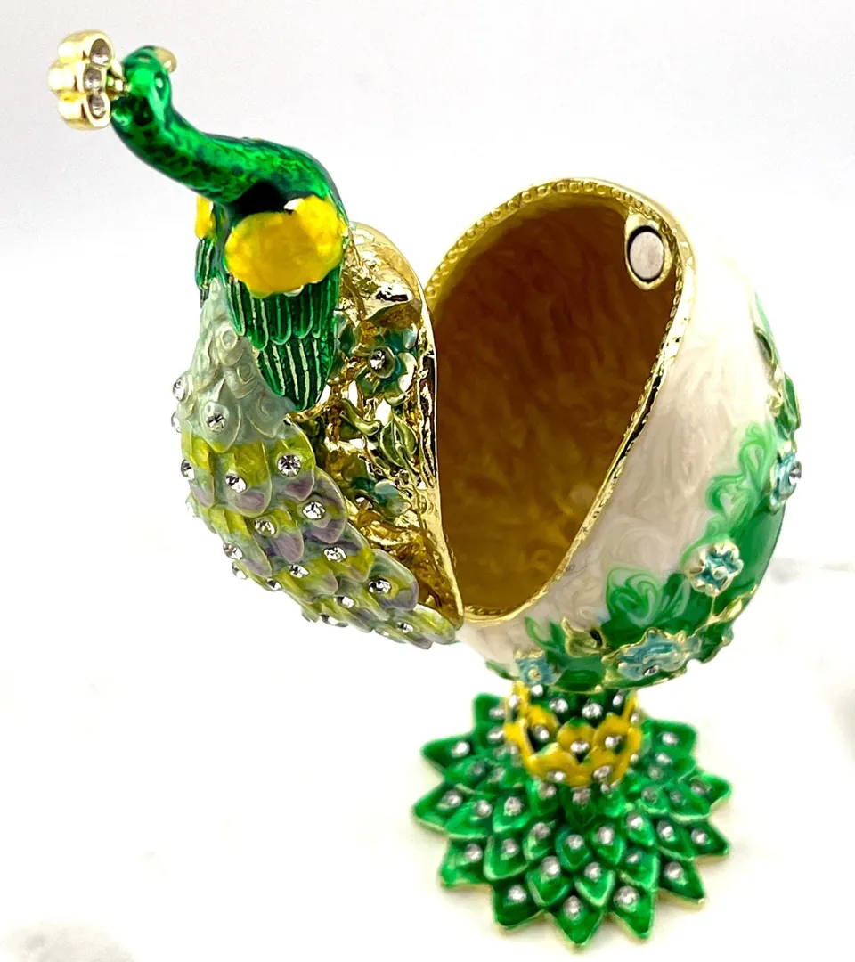 PEACOCK  Designr Green Faberge Easter Eggs in the Russian Faberge style, featuring Swarovski elements and pure gold decoration. This handmade piece makes a perfect graduation luck gift for your daughter by Pierre Lorren.