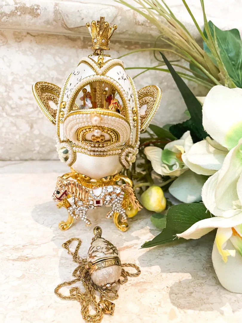 Vintage 2015 Faberge Egg Necklace featuring a Musical Carousel. Hand-carved natural egg with pure gold detailing and Swarovski diamonds. A perfect 10th anniversary gift for a wife.